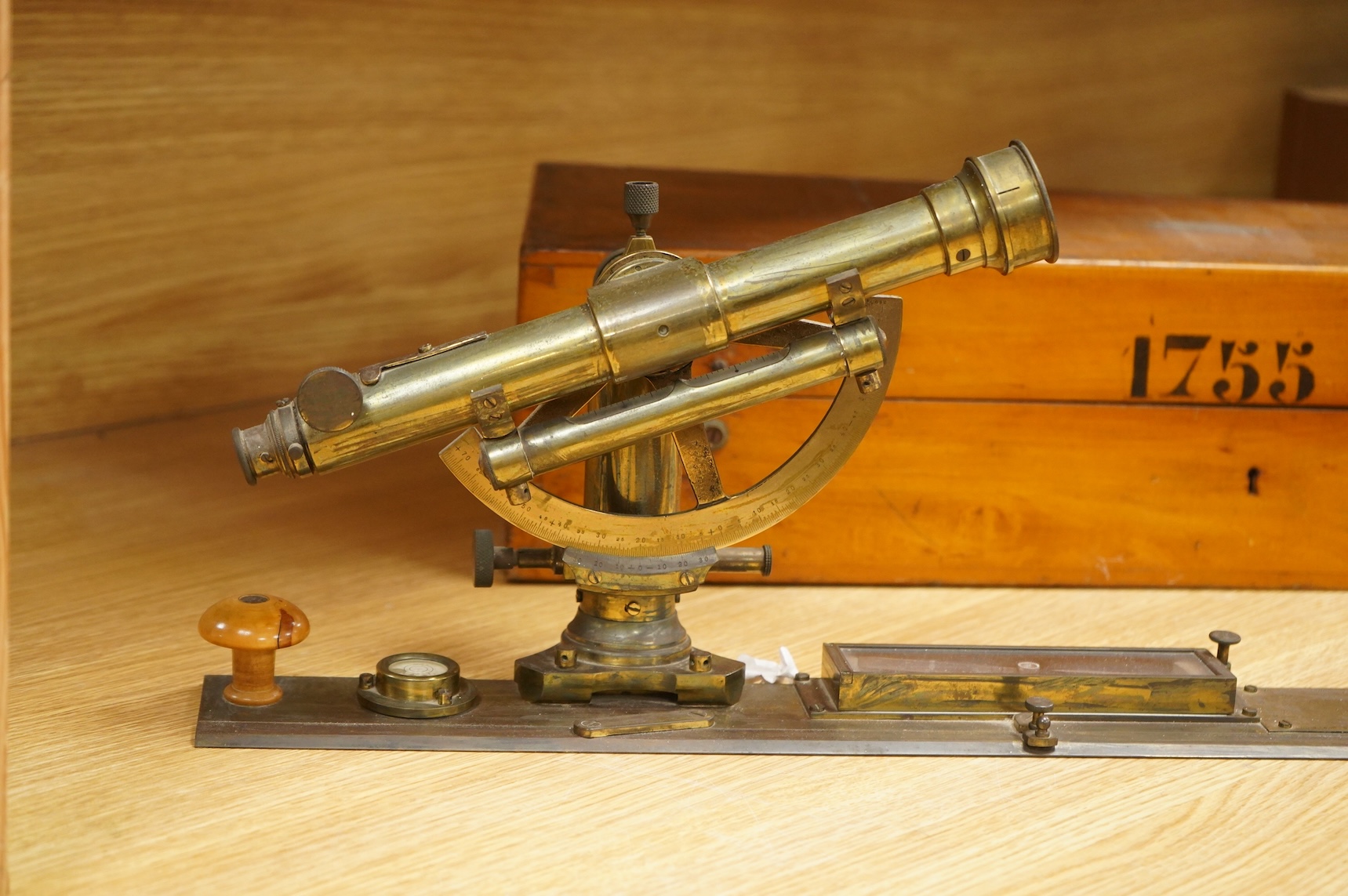 A German brass alidade by F. Sartorius, Göttingen, number 1755, 58.5cm wide, contained within a fitted birch case with applied maker’s label and other reference markings, the case; 63cm wide, 14cm high, 25cm deep at the